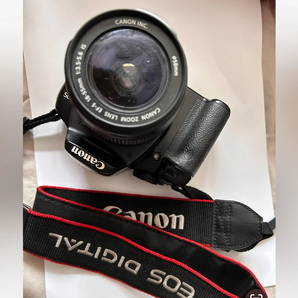 Canon EOS Rebel sxi Camera comes with only as shown in photos